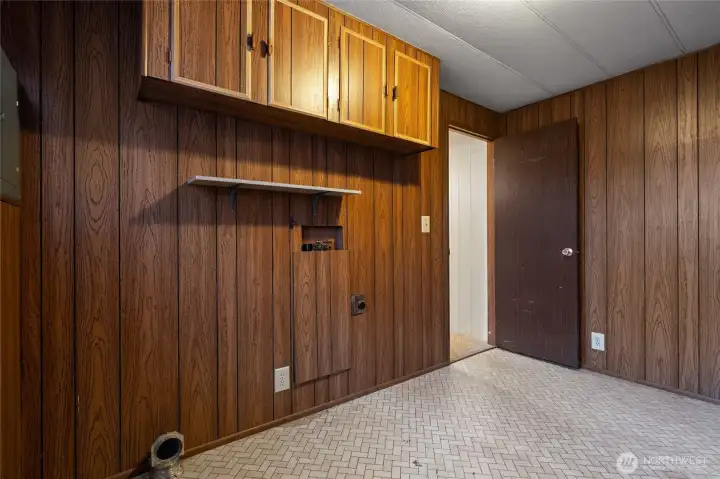 Look at this large utility room with extra storage!