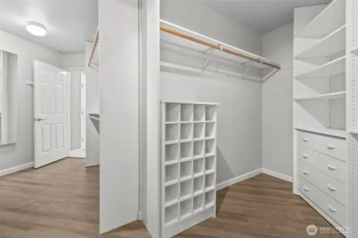 Large walk-in closet in primary with direct access to laundry