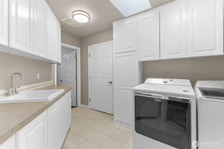Laundry with sink and cabinets