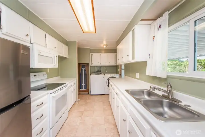 Kitchen with newer stainless steel refrigerator. Kitchen with newer stainless steel refrigerator.