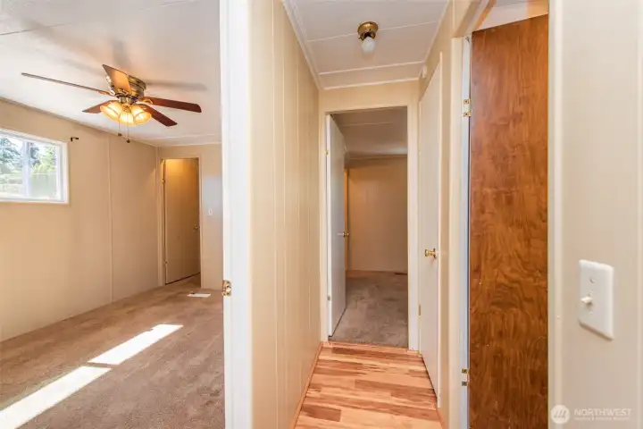 Bedroom 1 with walk in closet, hallway to bedroom 2, main bathroom on the right. Bedroom 1 with walk in closet, hallway to bedroom 2, main bathroom on the right.