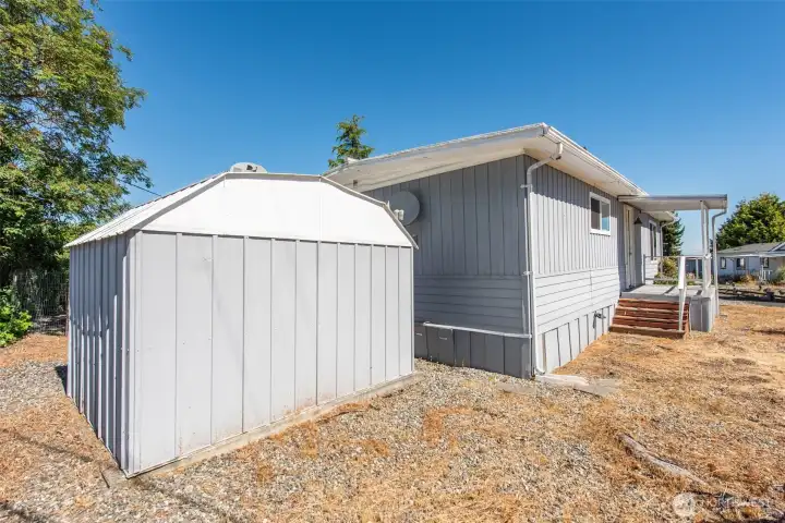 Another view of the front door and second storage shed. Another view of the front door and second storage shed.