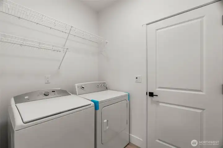 Laundry with garage and utility room access
