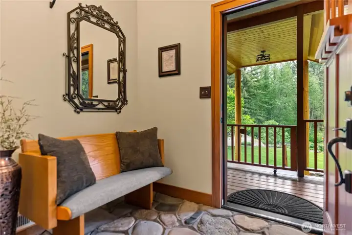 River stone floored entryway creates an elegant yet natural transition from outdoors to indoors.
