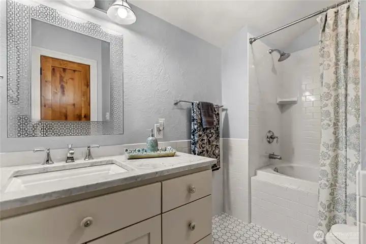 Upstairs bathroom includes a jacuzzi tub.