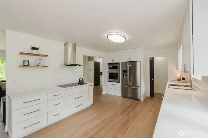 Quarts counter tops, top of the line KitchenAid SS appliances, soft close cabinets.