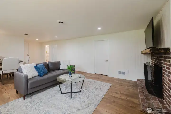 Another view of separate living space with wood burning fireplace.