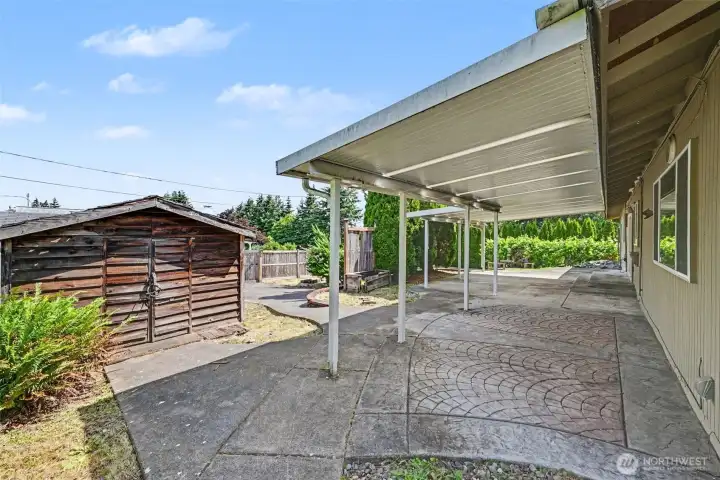 Step outside to discover a private backyard retreat complete with a covered patio.