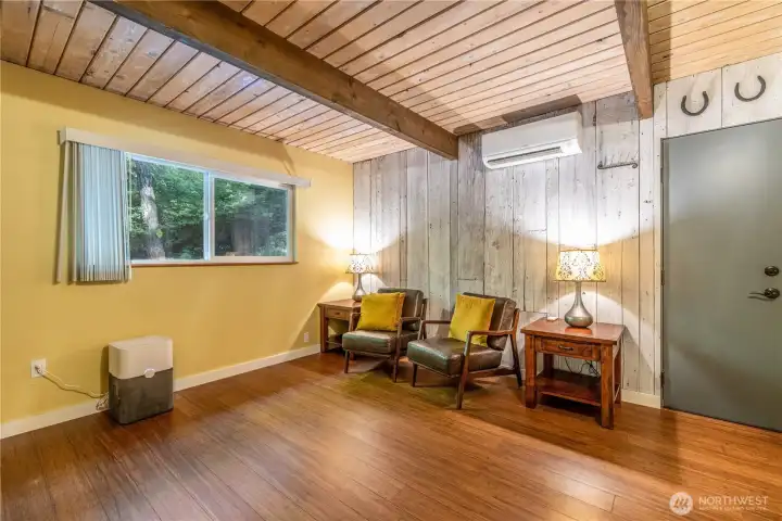 The TV room with the door leading to the garage