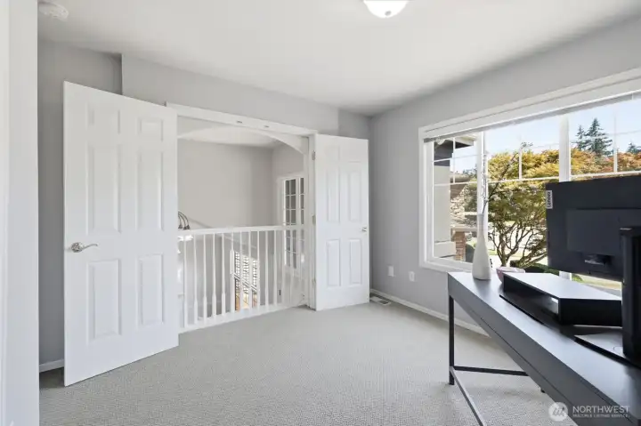 Upstairs bedroom with a Romeo & Juliet balcony.