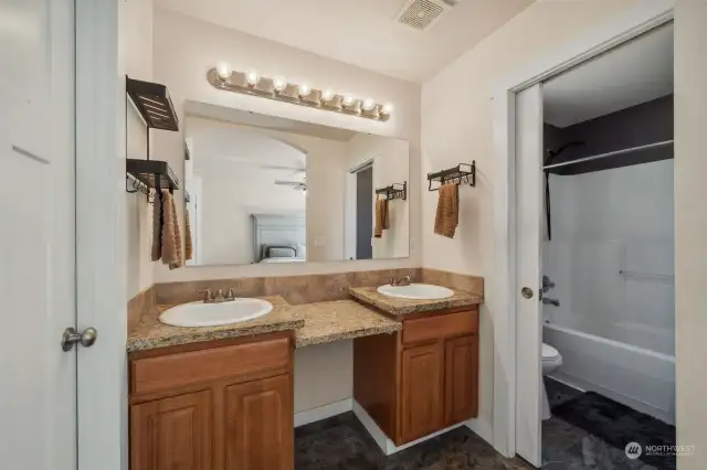 Dual sinks and vanity in primary bath.