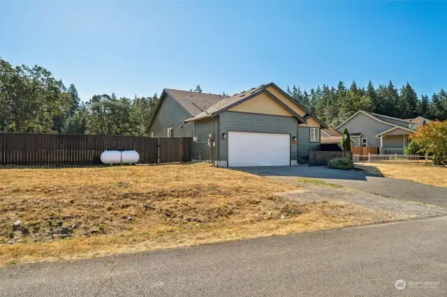 Front yard - propane tank is owned so you can select the best priced company to fill it when needed.