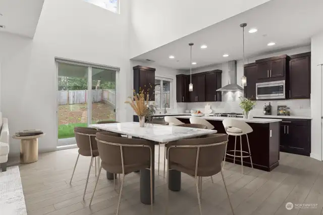 Dining area + kitchen with eating space *virtually staged*