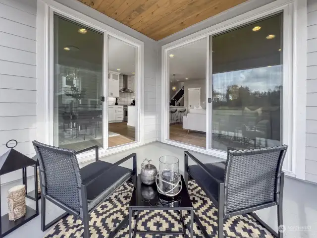 The large, covered deck offers a seamless transition from the living and dining rooms with 2 sliding doors.