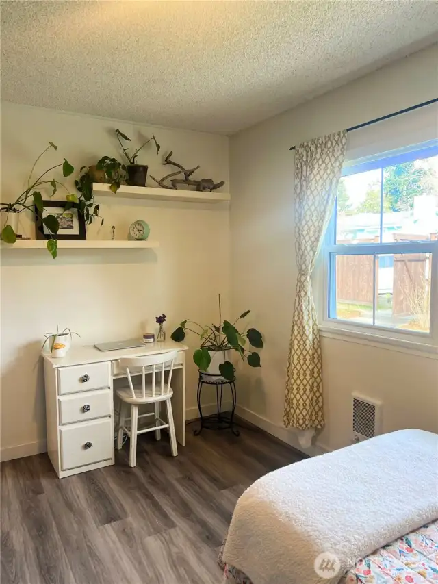 This spacious second bedroom is large enough for a home office.