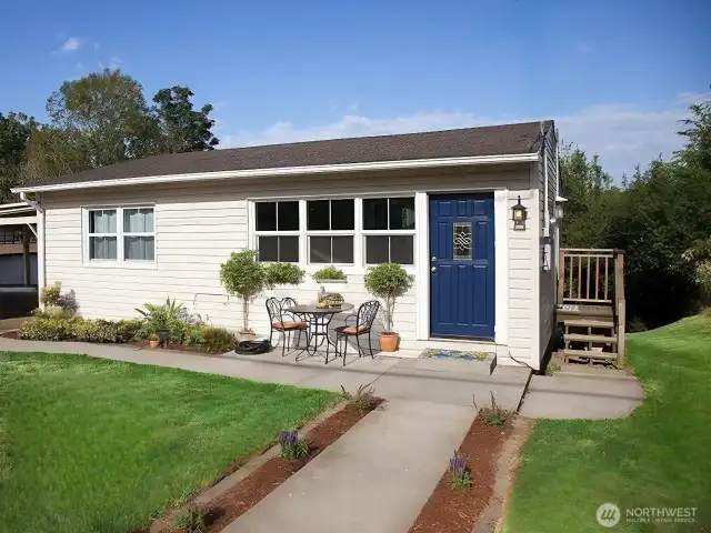 Charming Cape Cod sited on a fully fenced sunny lot.