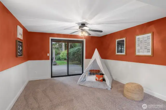 Lower level rec room has access to backyard.