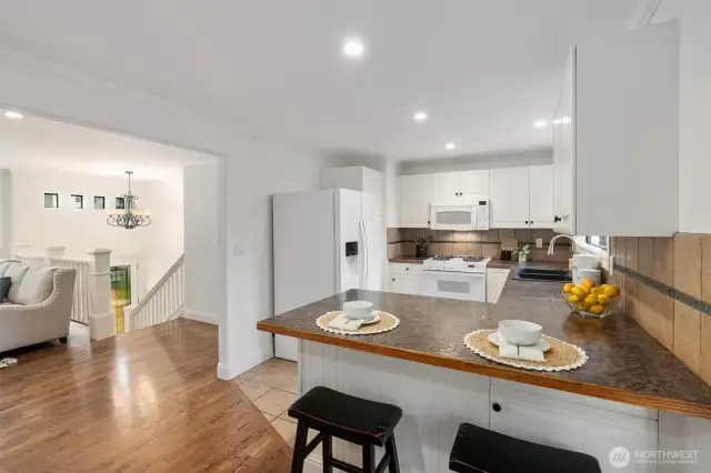Kitchen is conveniently located and has a great view of the back yard.