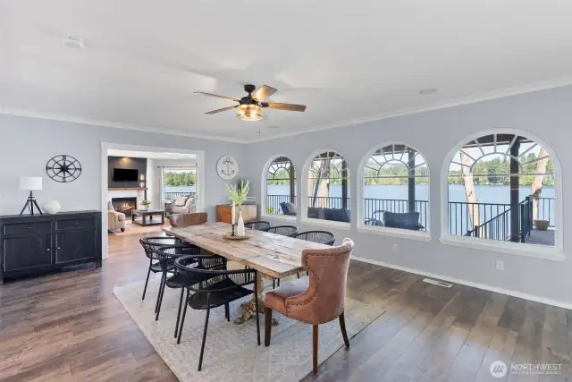 Dining room with views to the lake with deck beyond. Room is large enough to accomodate all your dining furniture.