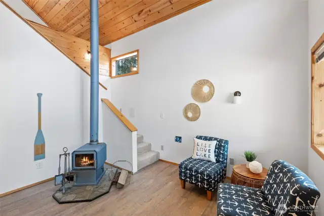 Living area in guest quarters w/cozy wood stove.