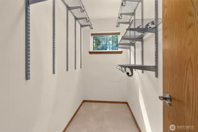 Main floor primary bedroom walk-in closet.