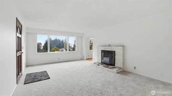 A bright, neutral living room providing a perfect canvas for any style or setup.