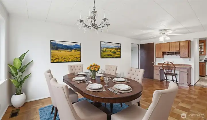 Virtually staged to inspire, this dining space features a bright setting ideal for everyday dining or special occasions