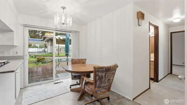 This cozy dining space overlooking the backyard—perfect for morning coffee or casual meals
