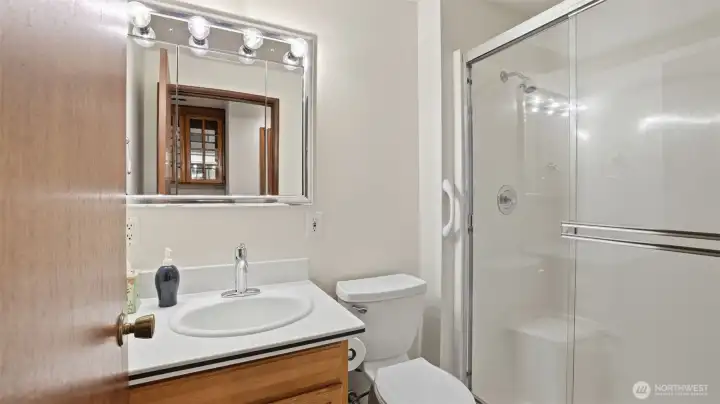 A well-placed 3/4 bathroom offering a clean design and easy access from nearby rooms.