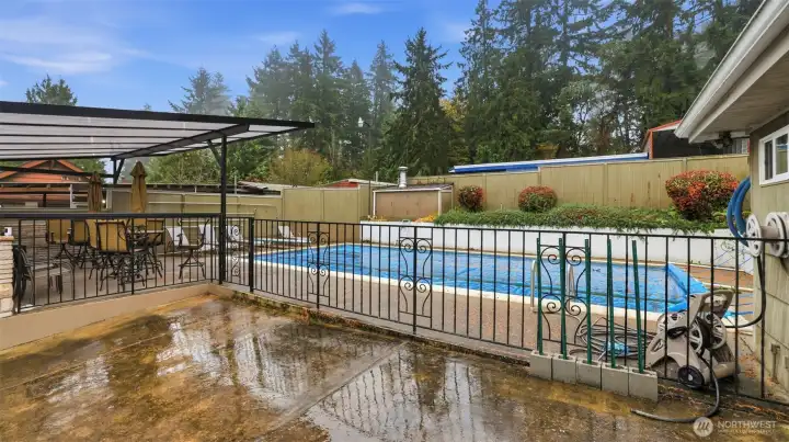 Enjoy a refreshing dip in your own backyard pool, complete with fenced surround and ample lounging space.