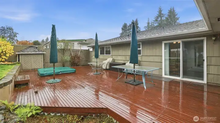 Expansive backyard deck offering plenty of room for outdoor dining, lounging, and entertaining.