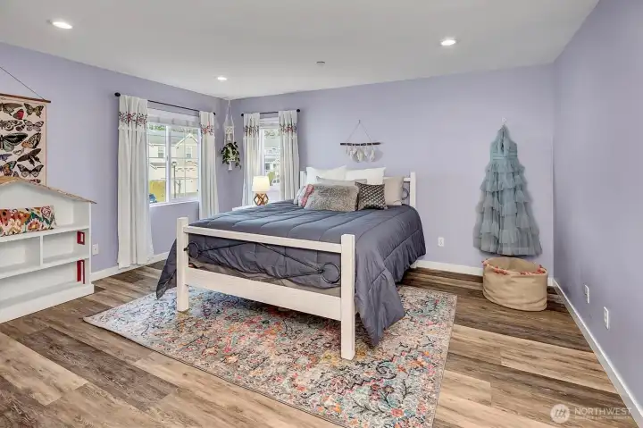 Bedroom 2 of 6 is generous in size, w/custom closet and beautiful natural light.