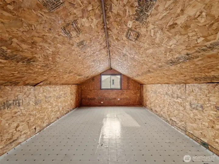 unfinished attic/loft accessible by staircase.