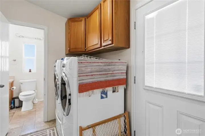 Laundry Room, accessibly from primary bathroom.