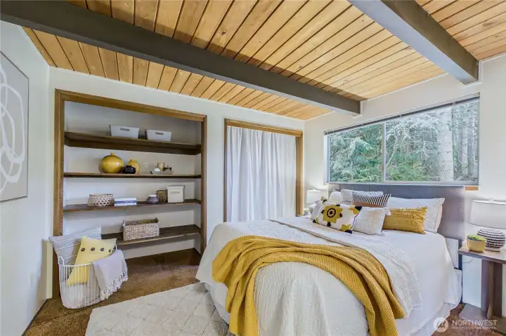 Downstairs bedroom with closet and shelves