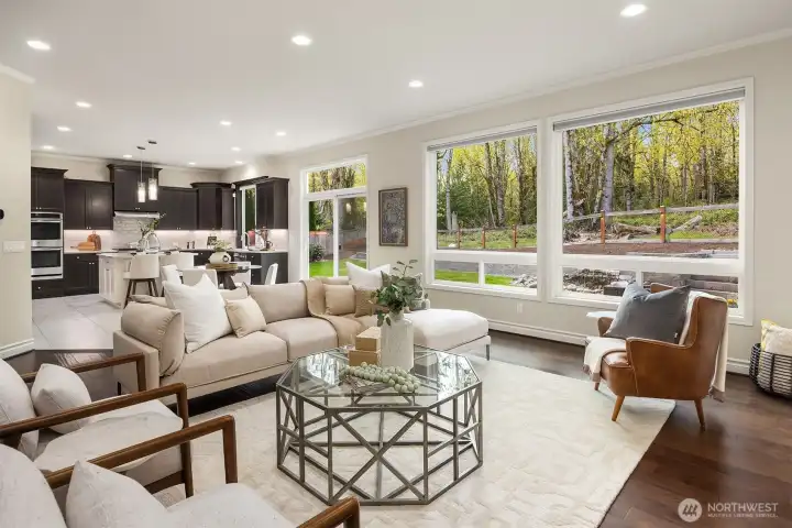 An open great room concept provides seamless flow that is open to the chef’s kitchen. The space is designed for both effortless entertaining and everyday living.