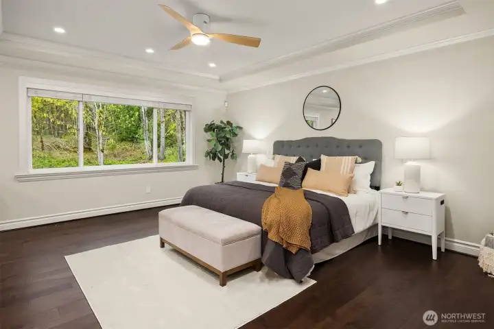 Private primary retreat (bedroom #2) on the second level features elegant french doors and windows framing serene views.  Buchan signature details - a tray ceiling with crown molding detail, an inviting reading nook for quiet moments.  Wide-Plank hardwood flooring underfoot. Overlooking lush grounds, Koi ponds & tranquil water features as you drift off to sleep.