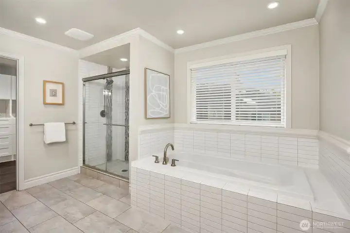 An indulgent soaking tub offers a spa-like experience at home.