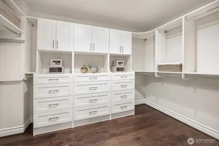 A spacious custom-designed closet system provides exceptional organization.