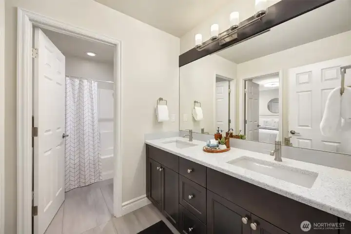 Quartz slab countertops and undermount sinks deliver both style and durability.