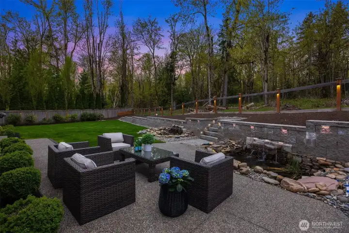 Lush, manicured grounds enhanced by abundant landscape lighting and supported by a multi-zone automatic irrigation system, ensuring effortless maintenance and year-round vibrancy - day and night.