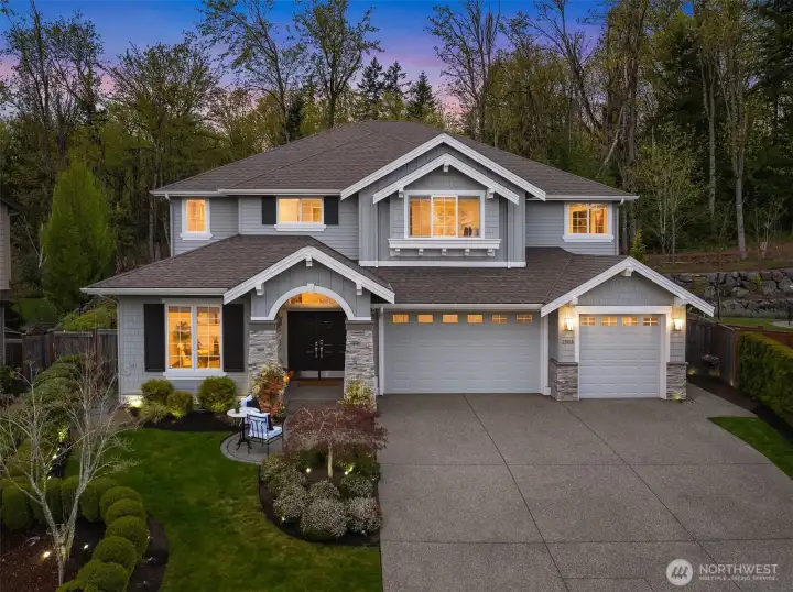 An oversized 3-car side-by-side garage offers abundant space for vehicles and storage. The garage is EV charging ready for modern convenience.