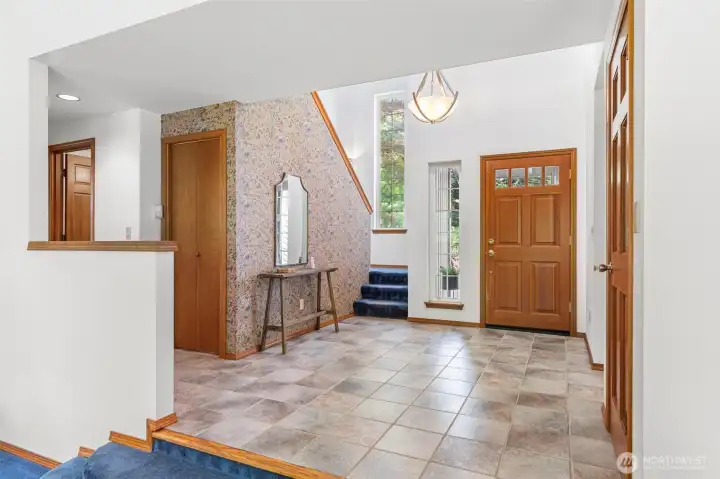 Beautiful, wide entryway for greeting your guests, large coat closet & soaring ceiling to let in the light. Beautiful, wide entryway for greeting your guests, large coat closet & soaring ceiling to let in the light.