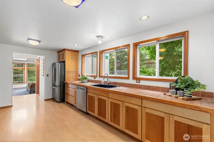 Windows, windows and more windows... here the view is more pines plus a concrete grill patio and kennel area. Windows, windows and more windows... here the view is more pines plus a concrete grill patio and kennel area.