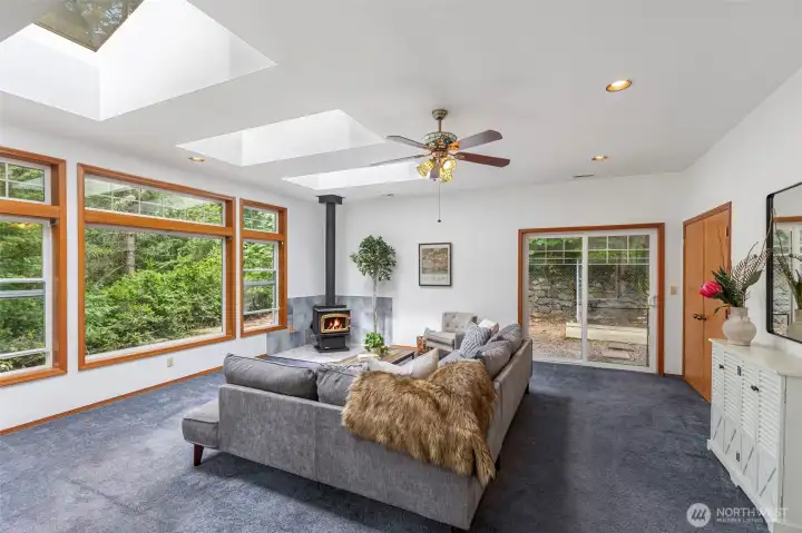 Are you seeing these extra wide skylights? There are extra registers for the A/C to cool this space in summer and the woodstove keeps everyone toasty & cozy in winter. The slider makes it easy to let the furry ones in and out. The solid core wood doors on the right is the laundry space. Are you seeing these extra wide skylights? There are extra registers for the A/C to cool this space in summer and the woodstove keeps everyone toasty & cozy in winter. The slider makes it easy to let the furry ones in and out. The solid core wood doors on the right is the laundry space.