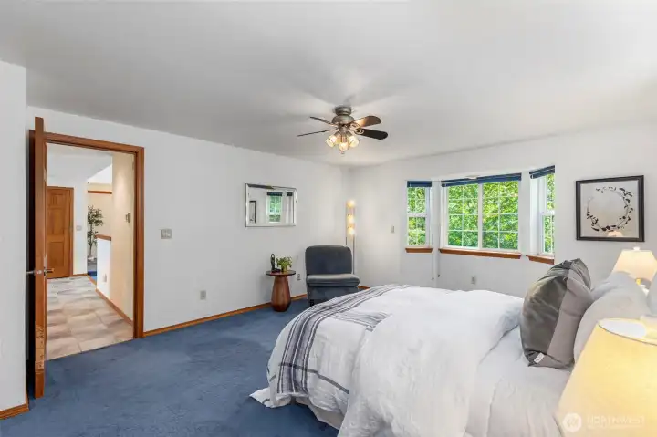 Now we walk to to the other end of the main floor to the Primary bedroom suite. More great air flow and windows to the pines. Now we walk to to the other end of the main floor to the Primary bedroom suite. More great air flow and windows to the pines.