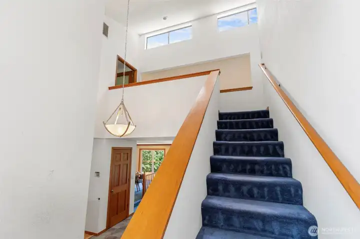 You'll love the dramatic, tall open stairwell and YEP! More windows :) You'll love the dramatic, tall open stairwell and YEP! More windows :)