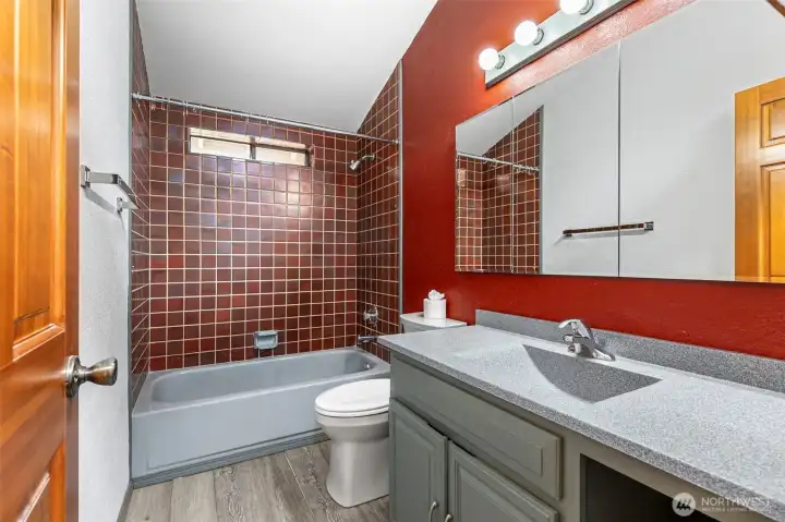 There's also an updated full bathroom upstairs with great tile and an oversized vanity countertop and mirror. There's also an updated full bathroom upstairs with great tile and an oversized vanity countertop and mirror.