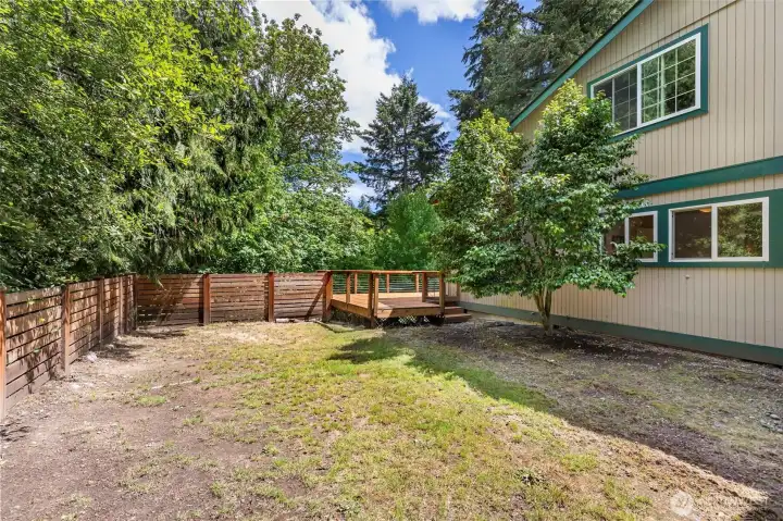 This shows the couple of steps down to the large, level side yard area. This shows the couple of steps down to the large, level side yard area.