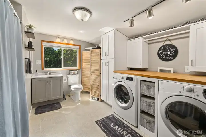 Laundry room and full bathroom. Laundry room and full bathroom.